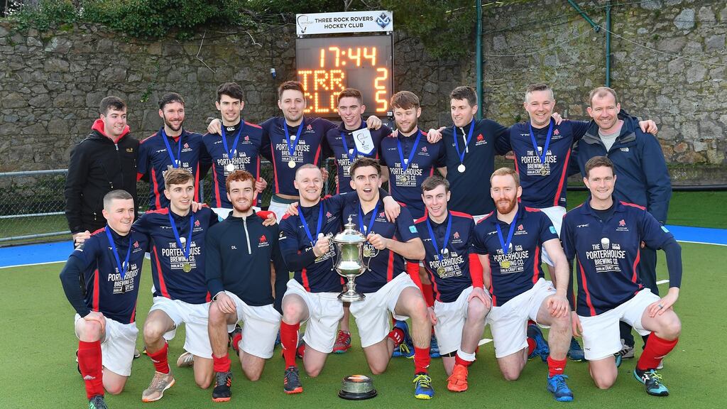 Clontarf celebrate after their victory in the Neville Cup Final against Three Rock Rovers at Grange Road. Photograph: Adrian Boehm