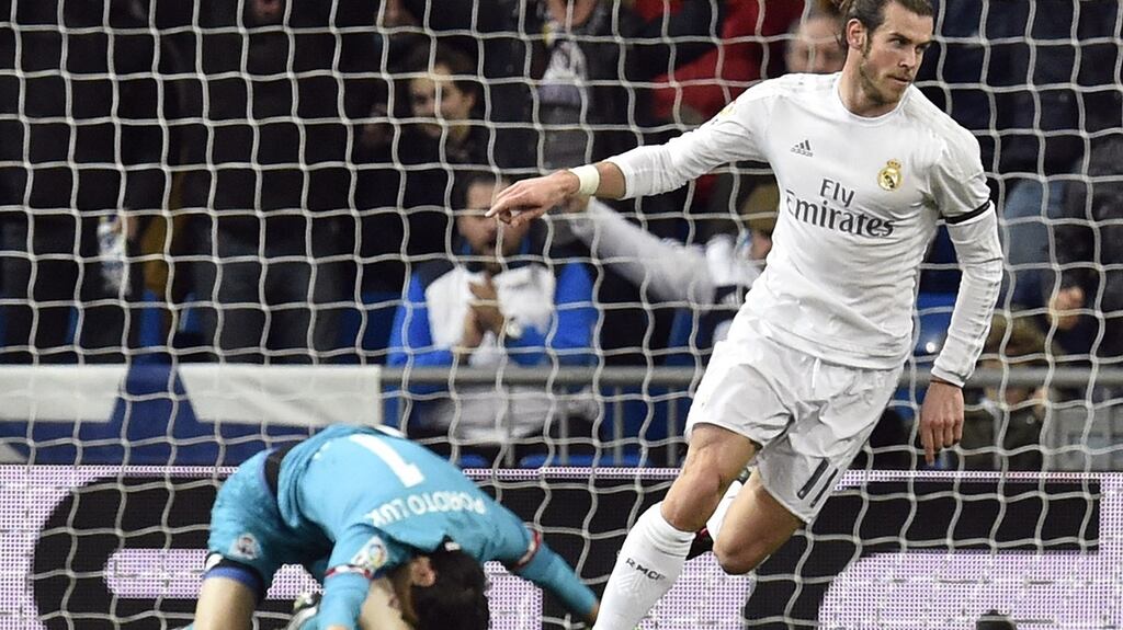Gareth Bale wheels away after scoring the first goal of his hat-trick in Real Madrid’s Primera Division win over Deportivo La Coruna at the Santiago Bernabeu. Photograph: Gerard Julien/AFP/Getty Images