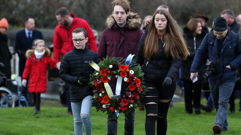 Cousins Sean Strutt (10), Mark Feery (18) and Sophie Feery (18), great great grandchildren of Bloody Sunday victim Michael Feery. Photograph: Brian Lawless/PA Wire