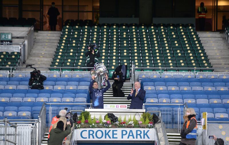 Stephen Cluxton lifts the Sam Maguire in an empty stand after Dublin complete their six-in-a-row in a Covid-affected campaign in 2020.
Photograph: Dara Mac Dónaill