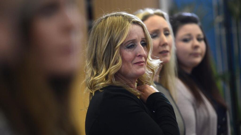 Róisín Molloy listens to MInister for Health James Reilly during the Department of Health press conference on Portlaoise Midland Regional Hospital Maternity Services, yesterday. Photograph: Cyril Byrne/The Irish Times