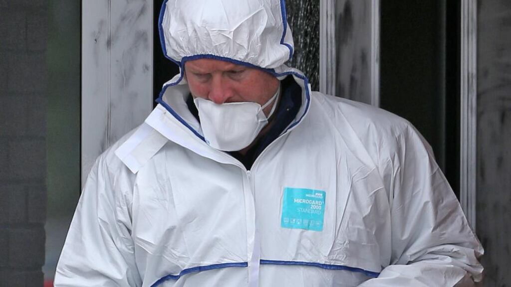 Evidence is removed from the scene of a shooting at a house on the Kiltalown Road, Tallaght. Photograph: Colin Keegan, Collins Dublin