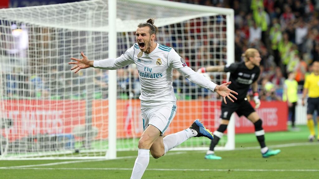 Gareth Bale of Real Madrid celebrates scoring a goal against Liverpool during last year’s  Champions League final. Photograph:  MB Media/Getty Images