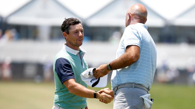 Rory McIlroy shakes hands with Stewart Cink after his final round at Kiawah Island. Photograph: Cliff Hawkins/Getty