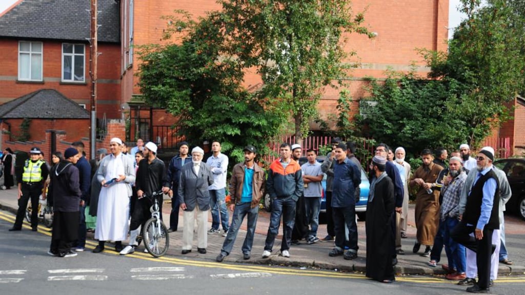 Local residents near to the scene of a house fire at Wood Hill, in the Spinney Hills area of Leicester. Photograph: Rui Vieira/PA Wire