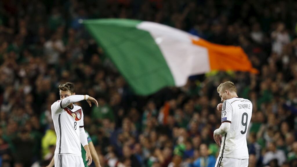 Germany’s Andre Schurrle and Mesut Ozil look dejected after Shane Long scored for the Republic of Ireland. Photograph: Phil Noble/Reuters