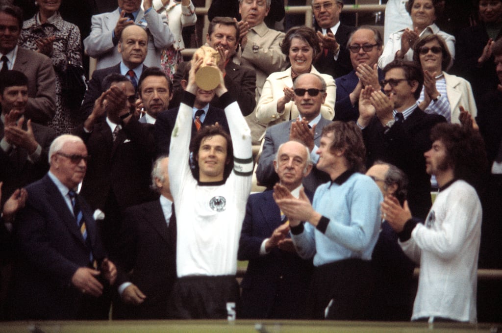 Captain Franz Beckenbauer raises the World Cup trophy after Germany defeated the Netherlands 2-1 in the 1974 final. Photograph: Werner Schulze/Getty Images
