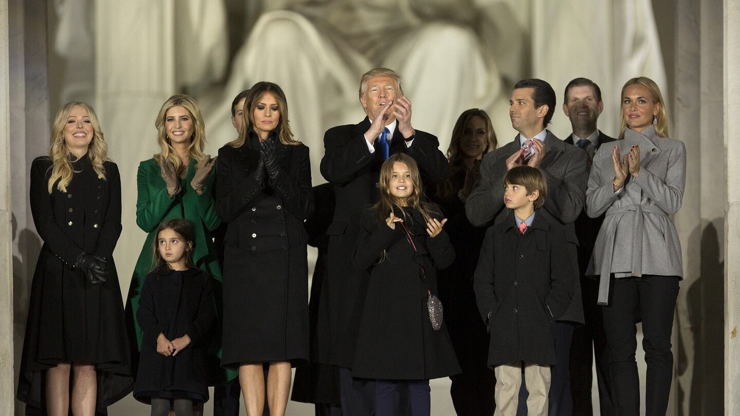 Donald Trump applauds while standing with his family during the “Make America Great Again” Welcome Celebration concert. Photographer: Chris Kleponis/Pool via Bloomberg
