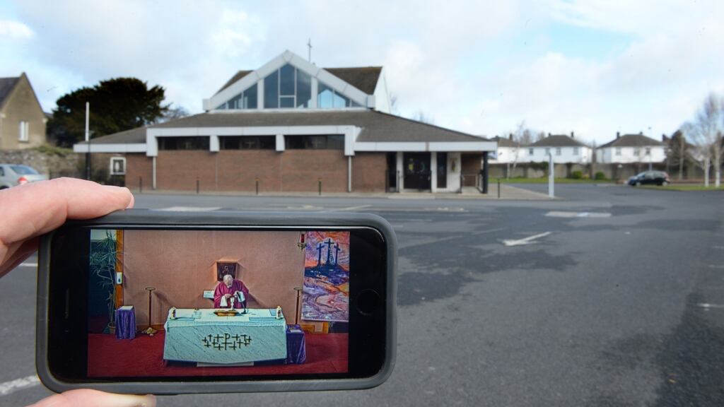 The car park at St Brendan’s church in Coolock, Dublin, stands empty last March as Fr Paddy Stanley celebrates Sunday Mass broadcast live via webcam. Photograph: Dara Mac Dónaill