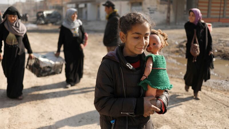 Displaced Iraqis flee their homes while Iraqi forces battle with Isis militants, in western Mosul. Photograph: Reuters