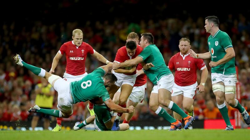 Jack Conan, Jack Carty and Niall Scannell tackle Owen Watkin of Wales. Photograph: James Crombie/Inpho
