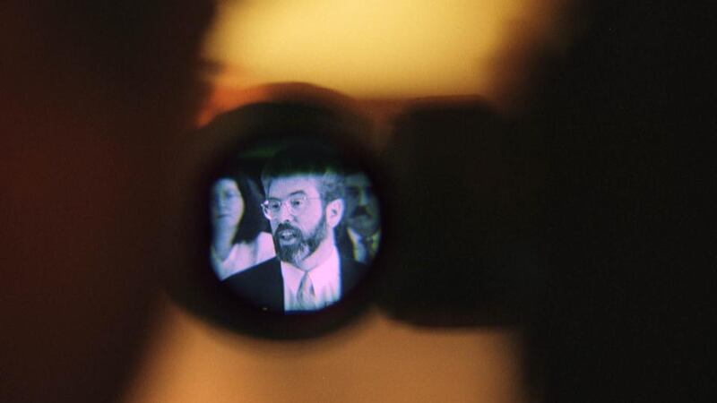 Armalite and ballot box: Gerry Adams launches a Sinn Féin manifesto in 1998. Photograph: Dara Mac Dónaill