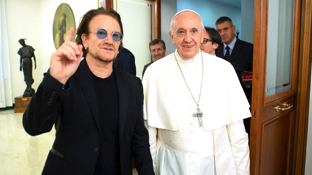 Bono with Pope Francis at the Vatican on Wednesday, the U2 singer was meeting the pontiff to sign an agreement between Bono’s charity, ONE, and the Scholas Occurentes educational charity. Photograph: AFP/Getty Images