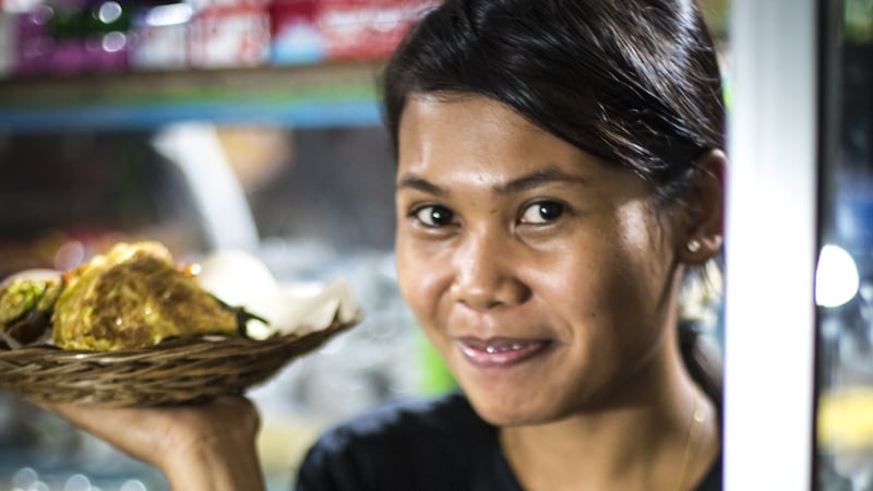 Serving dinner at a warung (a family-owned cafe) on Gili Meno