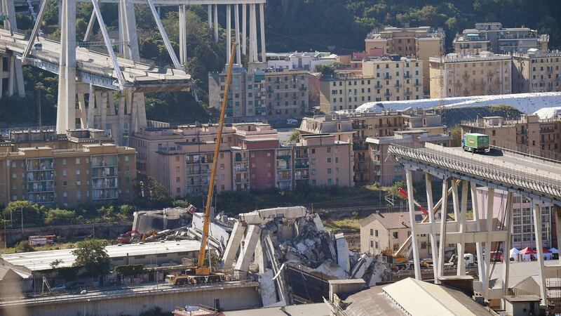 A general view of the collapsed Morandi Bridge a day after the disaster in Genoa, Italy, in which at least 37 were killed, according to Genoa police. Photograph: Luca Zennaro/EPA