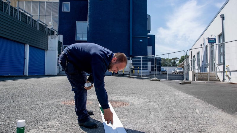 Naas track foreman Roy Butler marks out routes for entry. Photograph: Morgan Treacy/Inpho