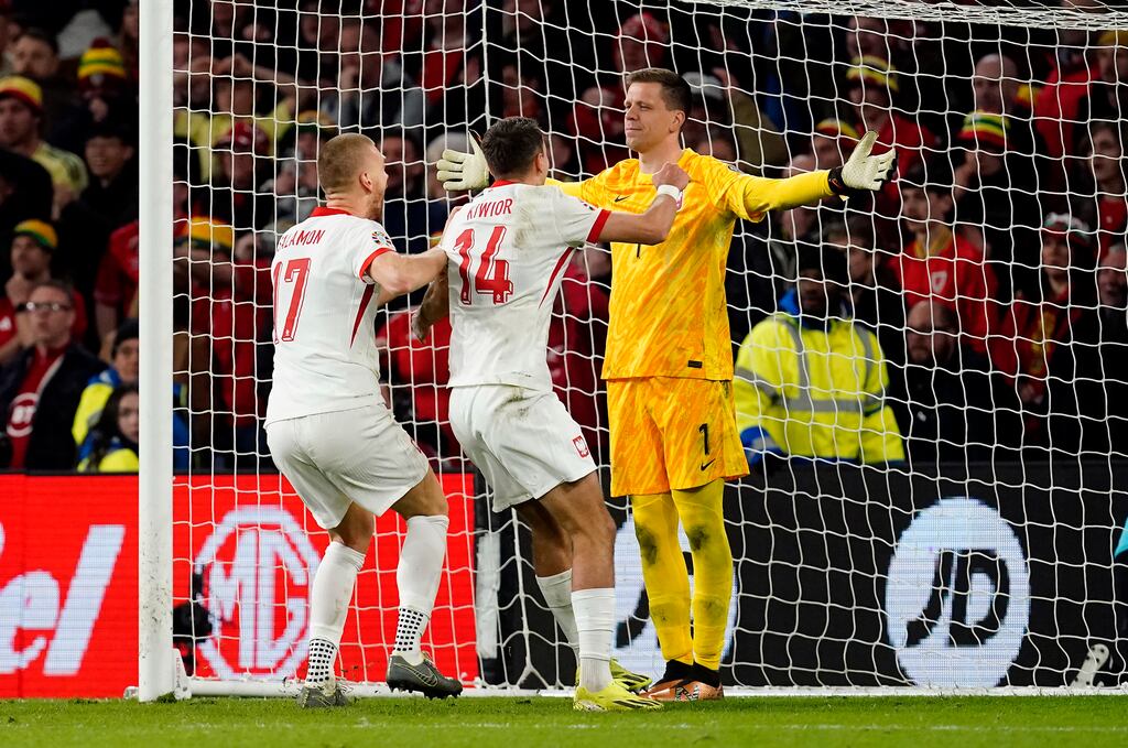 Poland goalkeeper Wojciech Szczesny celebrates after saving Daniel James's penalty in the shoot-out. Photograph: Nick Potts/PA Wire