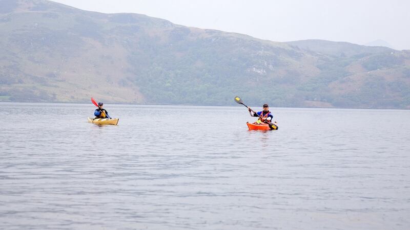 Kayaking across Caragh Lake. Photograph: Tadgh Hayes