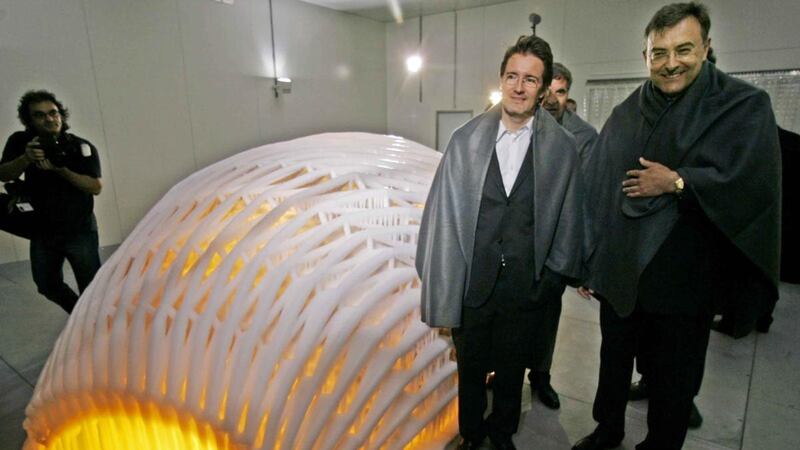 Olafur Eliasson and BMW chief executive Norbert Reithofer (right) stand in subzero temperatures at Eliasson’s “Your mobile expectations: BMWH2R project” in Munich in May 2008. The artist coated the hydrogen powered race car prototype BMWH2R with a fragile layer of ice. Photograph: Diether Endlicher/AP