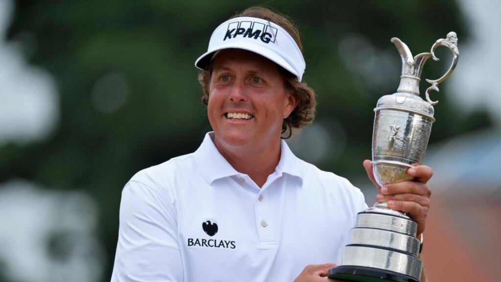 Phil Mickelson holds the Claret Jug after winning the British Open golf championship at Muirfield in Scotland. Photo: TobyMelville/Reuters