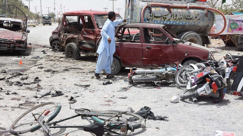 Security officials inspect the scene of a suicide bomb attack – in which 29 people were killed – near a polling station in Quetta, Pakistan, on Wednesday. Photograph: Jamal Taraqai/EPA