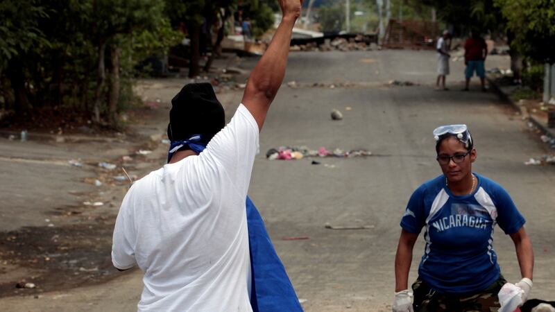 A university student holds up his arm during a protest over reform to the pension plans of the Nicaraguan Social Security Institute (INSS) in Managua, Nicaragua. Photograph: Oswaldo Rivas/Reuters