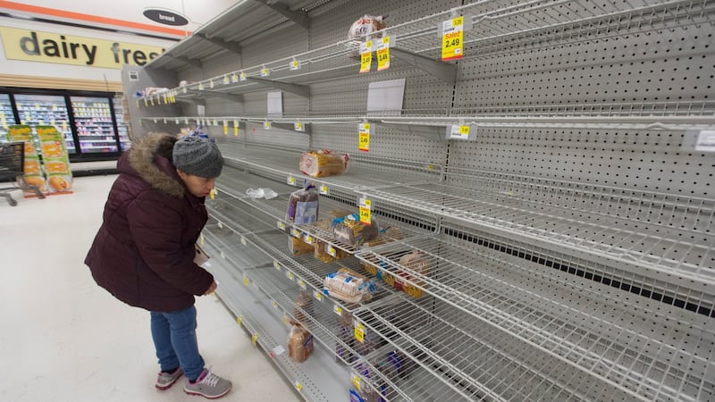 A customer looks at the heavily depleted bread section in a supermarket as shoppers prepare for an approaching snowstorm in Alexandria, Virginia. Photograph: Michael Reynolds/EPA