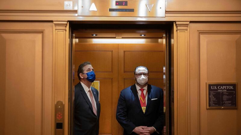Bruce Castor (left), defence lawyer for former US president Donald Trump, in an elevator in the US Capitol on Tuesday. Photograph: Chip Somodevilla/POOL/AFP via Getty Images