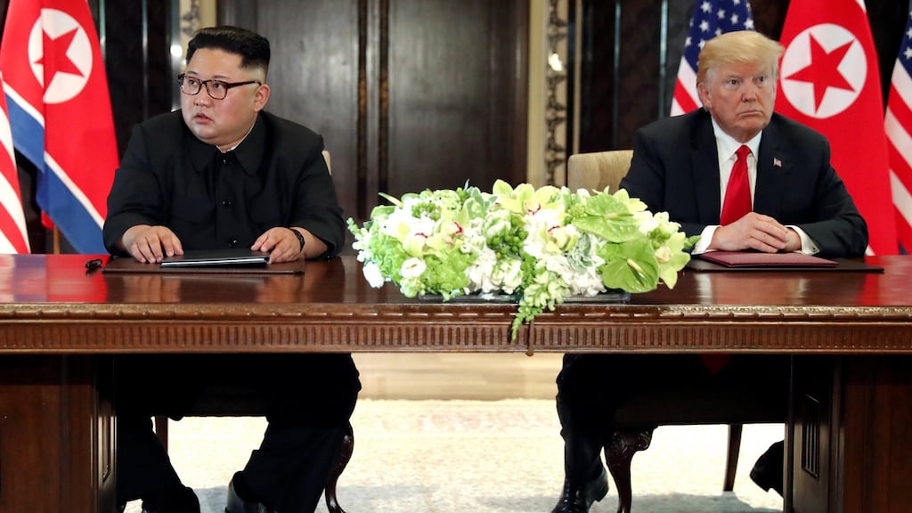 US president Donald Trump and North Korea’s leader Kim Jong-un hold a signing ceremony at the conclusion of their summit on the resort island of Sentosa, Singapore in June. Photograph: Jonathan Ernst/Reuters