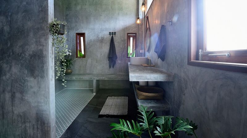 A micro-cement finish is not only space-enhancing in a bathroom but it’s also on-trend. Photograph: Getty Images