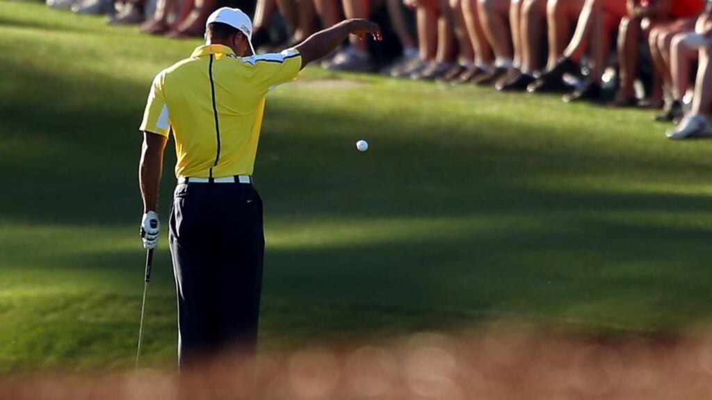 Tiger Woods drops his ball after he hits it into the water on the 15th hole during the second round of the 2013 Masters Tournament at Augusta. Photograph: Mike Ehrmann/Getty Images
