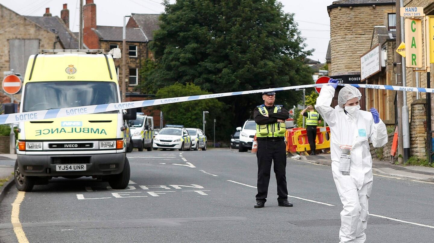 A police forensics officer works behind a police cordon in Birstall near Leeds, where Jo Cox was attacked and fatally injured. Photograph: Reuters/Craig Brough