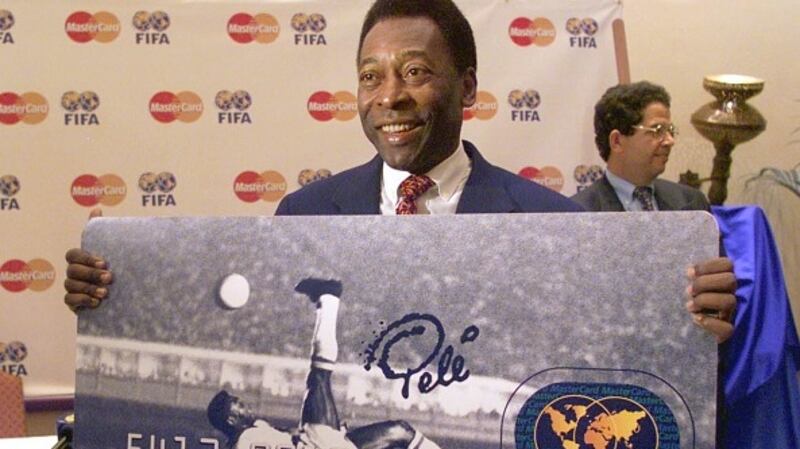 Brazilian soccer legend Pele presents a new MasterCard credit card showing his famous 1965 bicycle kick goal for Brazil against Belgium. Photograph: Getty Images