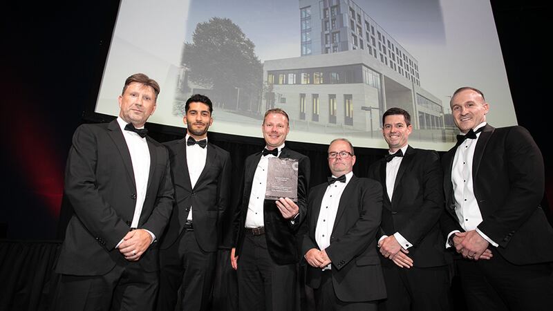 Gerard de Brún, Director, Fiontar Group, presents the Building of the Year – Educational award to the Reddy Architecture + Urbanism team.