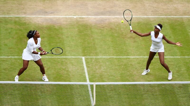 Serena  and Venus Williams in action during last year’s women’s doubles final at Wimbledon. Photograph:   Julian Finney/Getty Images