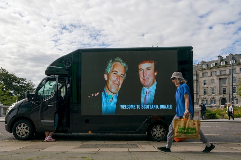 A photograph of US president Donald Trump and convicted child sex offender Jeffrey Epstein is displayed on the side of a van in Aberdeen during Mr Trump's recent trip to Scotland. Photograph: Jane Barlow/PA Wire