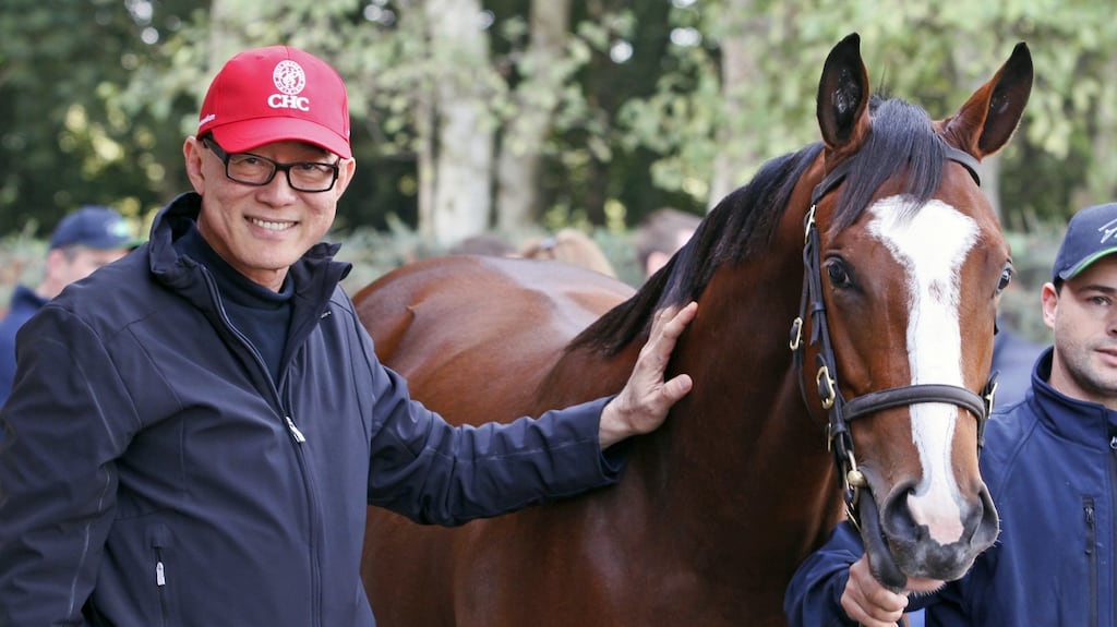 Teo Al Khing from the China Horse Club with the filly from Mountarmstrong Stud. Photograph: Peter Mooney