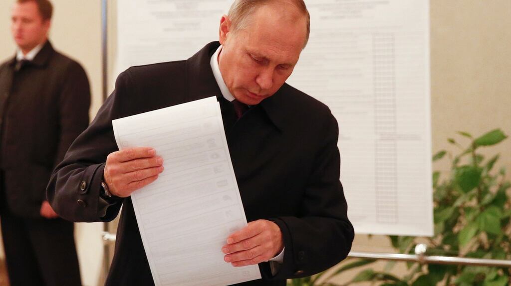 Russian president Vladimir Putin votes in Moscow on Sunday. Photograph: Grigory Dukor/AFP/Getty Images