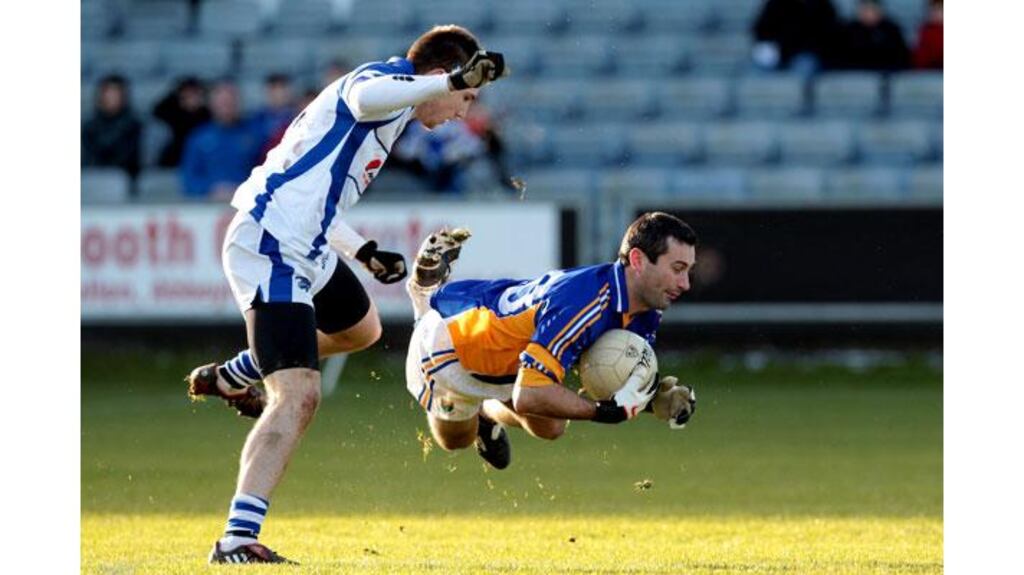 Laois's Daithi Carroll tackles Ciaran Hyland of Wicklow during their O'Byrne Cup at O'Moore Park in Portlaoise (Photograph: Cathal Noonan/Inpho)