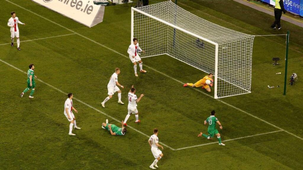 Lukasz Fabianski saves a header from Robbie Keane. Photograph: Ryan Byrne
