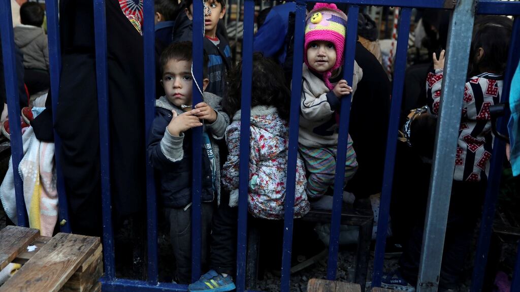 Children among refugees at the dangerously densely packed Moria camp on Lesbos. Photograph: Elias Marcou