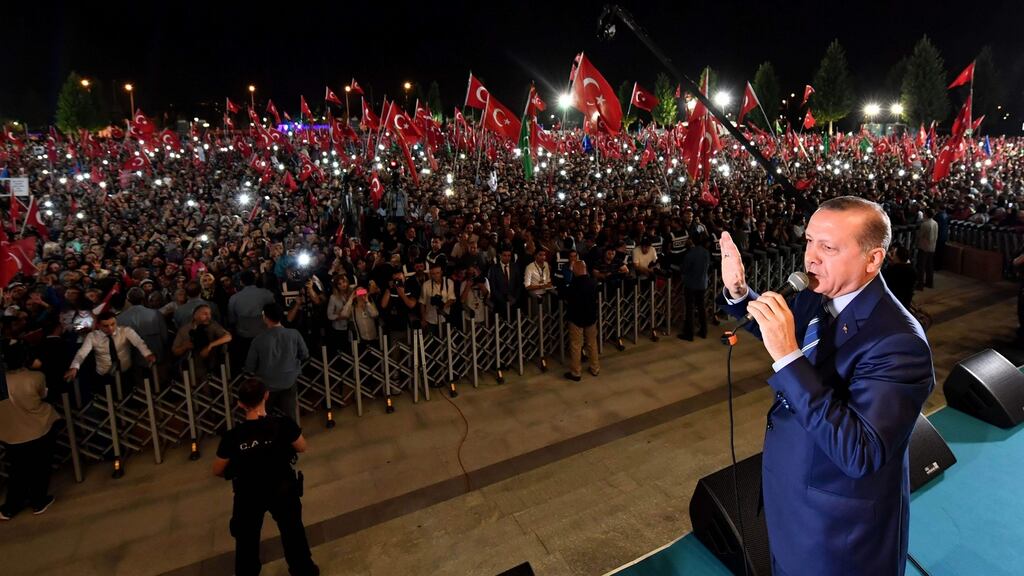 Turkish President Recep Tayyip Erdogan addresses people gathered at the Presidential Complex to protest against the July 15th failed military coup attempt in Ankara. Photograph: Kayhan Ozer/AFP/Getty Images