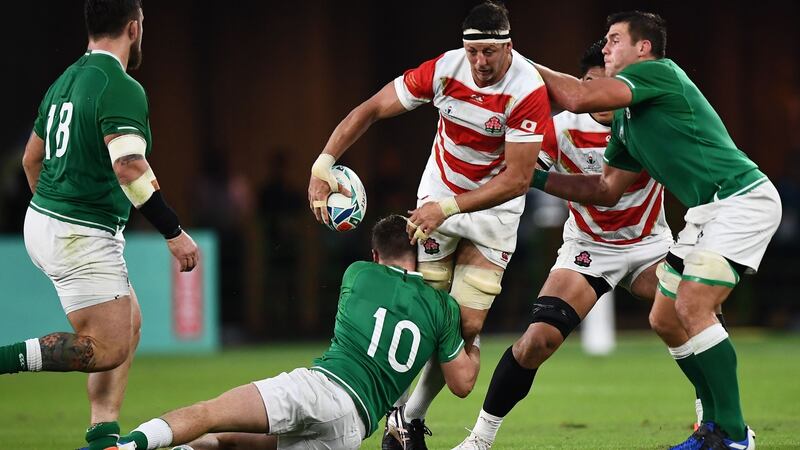 Japan lock Luke Thompson  is tackled by Jack Carty and CJ Stander during the game in  Shizuoka. Photograph: Anne-Christine Poujoulat/AFP/Getty Images