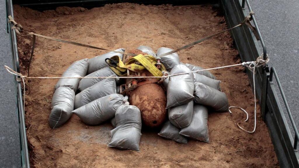 A 250kg second World War bomb found during excavation works at a Thessaloniki gas station in Greece is carried away on a military truck following an operation to defuse it. Photograph: Alexandros Avramidis/Reuters