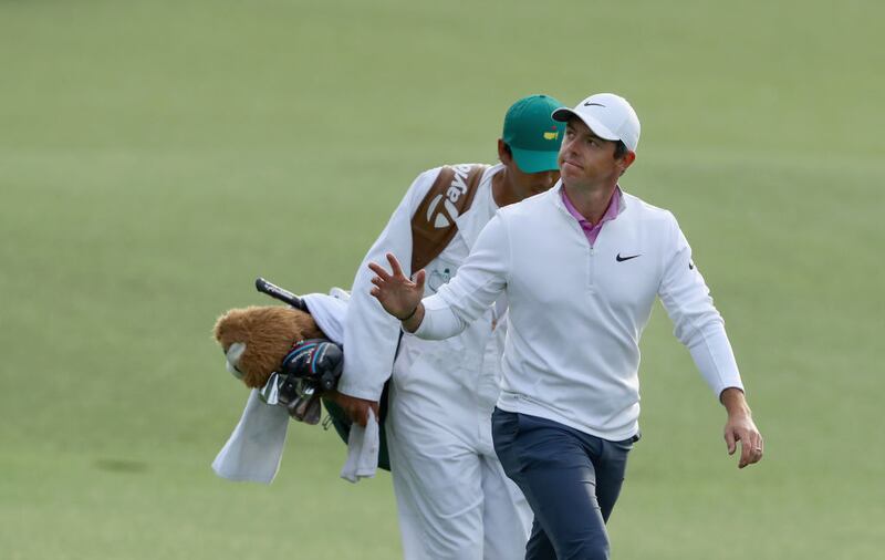 Rory McIlroy and caddie Harry Diamond walk up the 18th green during the final round of the 2018 Masters Tournament at Augusta National Golf Club. Photograph: David Cannon/Getty Images