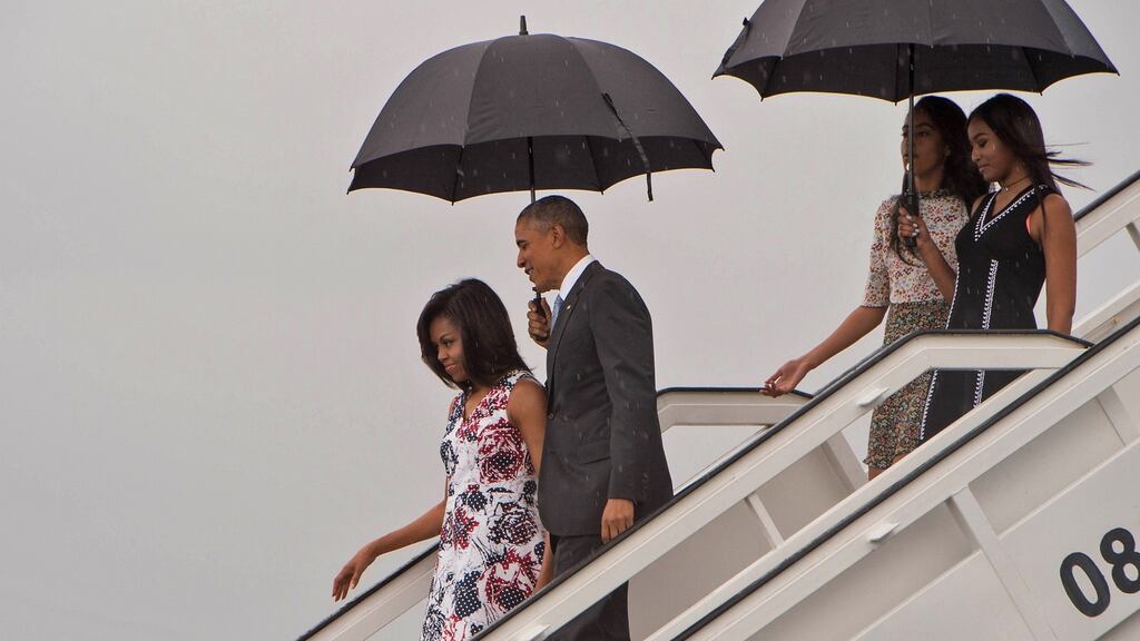 US president Barack Obama, First Lady Michelle Obama and daughters Malia and Sasha disembark from Air Force One at the Jose Marti International Airport in Havana. Photograph: Nicholas Kamm/AFP/Getty Images