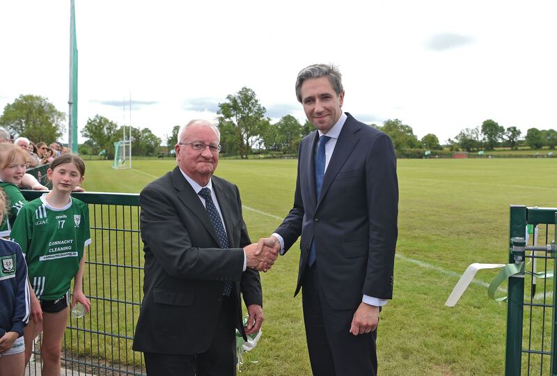 An Taoiseach Simon Harris with Marty Horkan after he performed the official opening of the Colm Horkan memorial pitch. Photograph: Conor McKeown