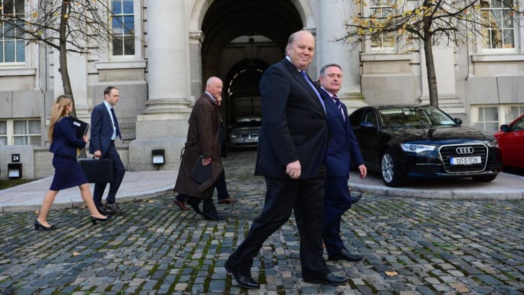 Minister for Finance Michael Noonan and cabinet colleague Minister for Public Expenditure and Reform Brendan Howlin at Government Buildings for the traditional Budget photocall yesterday. Photograph: Bryan O’Brien / THE IRISH TIMES