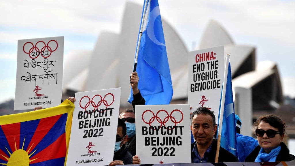 File photos of protesters holding up placards and banners as they attend a demonstration in Sydney to call on the Australian government to boycott the 2022 Beijing Winter Olympics over China’s human rights record. Photo: Saeed Khan/AFP via Getty Images