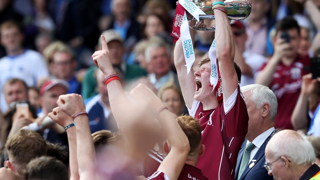 Galway’s Darren Morrissey lifts the trophy after winning the All-Ireland Minor Hurling Championship against Cork at Croke Park. Photo: Tommy Dickson /Inpho